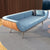 sofá en madera de nogal y tapizado en terciopelo de algodón. Dimensiones 204 x 74 x 55 cm