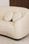 sofá redondo, tapicería Lama ref1, blanco, base roble oscuro acabado mate. Detalle vista lateral